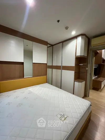 Modern bedroom with built-in wardrobe and stylish decor