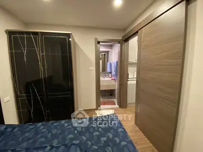 Cozy bedroom with ensuite bathroom and modern wardrobe