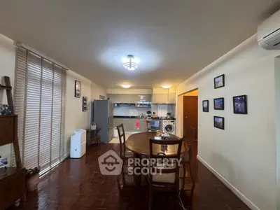 Spacious open-plan living and dining area with modern kitchen and stylish decor