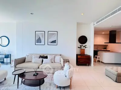 Spacious modern living room with elegant decor and open kitchen layout