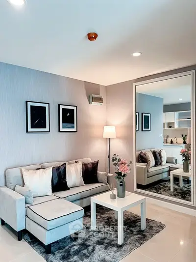 Modern living room with stylish decor and cozy seating area, perfect for relaxation and entertaining.
