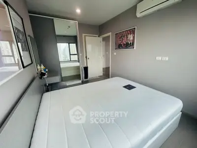 Modern bedroom with minimalist decor and large window view