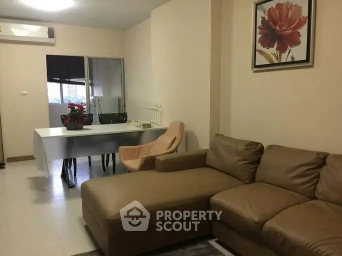 Modern living room with stylish furniture and elegant decor in a cozy apartment setting.