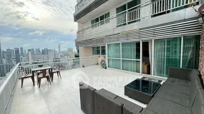 Spacious balcony with stunning city view, perfect for outdoor relaxation and entertainment.