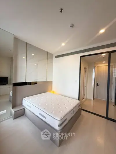 Modern bedroom with sleek design and glass partition in luxury apartment