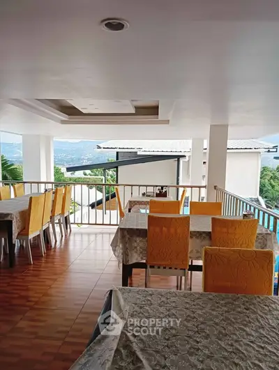Spacious balcony with dining area offering stunning mountain views