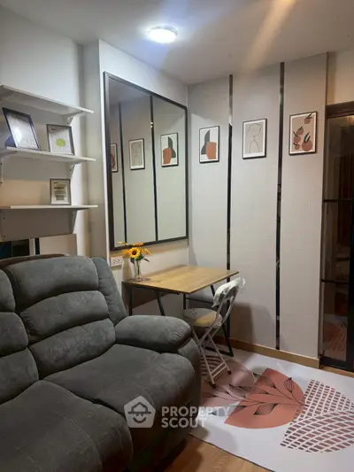 Cozy living room with plush sofa, modern decor, and stylish artwork.