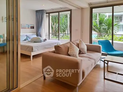 Spacious bedroom with pool view and modern decor