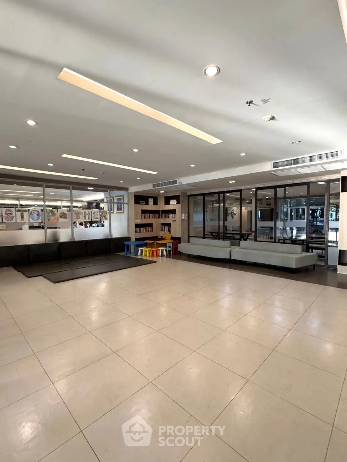 Spacious modern lobby with seating area and glass partitions