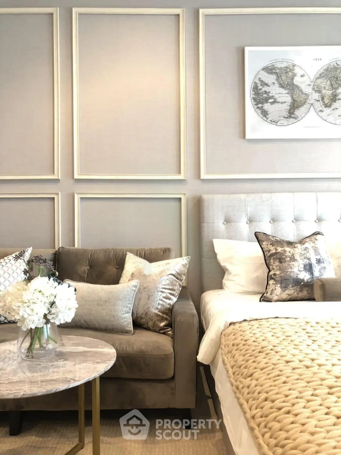 Luxurious bedroom with elegant decor and plush bedding in a modern apartment.