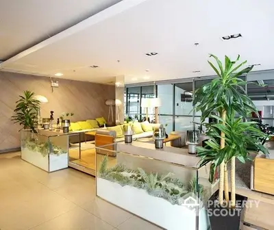 Spacious and modern living room with sleek design, featuring vibrant yellow accents and lush indoor plants for a refreshing ambiance.