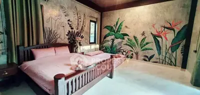 Luxurious bedroom with tropical-themed wall art and elegant wooden bed frame.