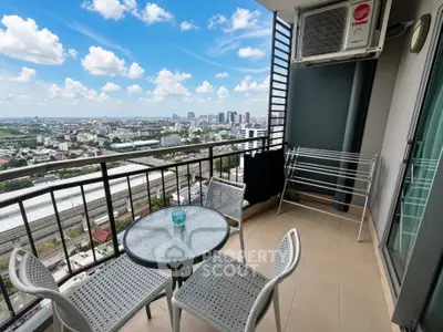 Stunning balcony with city view, perfect for relaxation and outdoor dining.