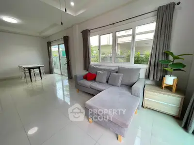 Spacious modern living room with large windows and stylish furniture