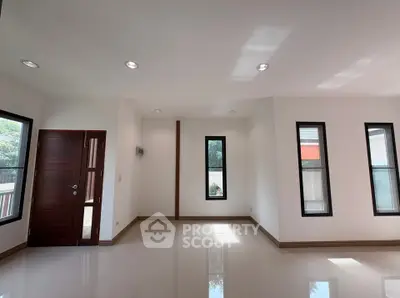 Spacious modern living room with natural light and sleek design