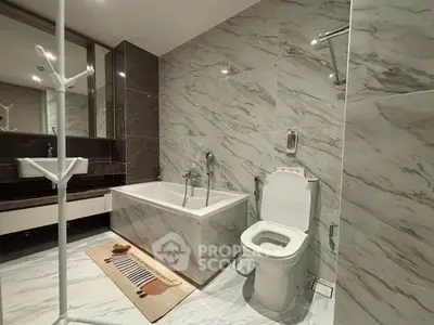 Luxurious modern bathroom with marble tiles and elegant fixtures