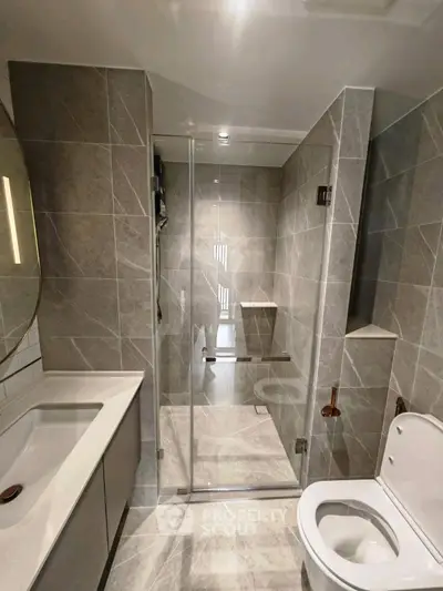 Modern bathroom with sleek design and glass shower enclosure