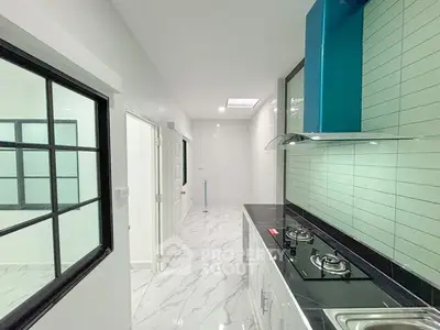 Modern kitchen with sleek gas stove and stylish backsplash