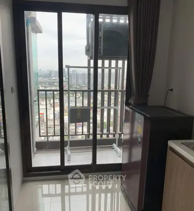 Modern apartment balcony with city view and sleek kitchen appliances
