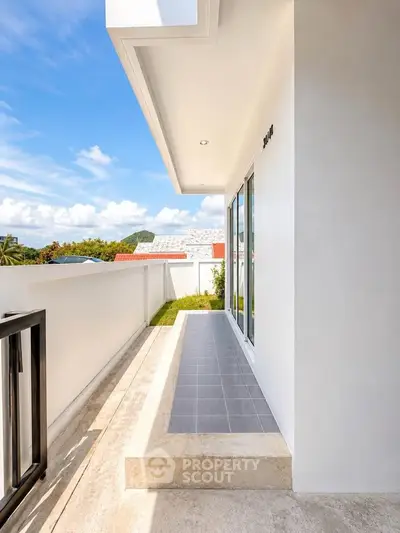 Modern balcony with sleek design and scenic view, perfect for relaxation and outdoor enjoyment.