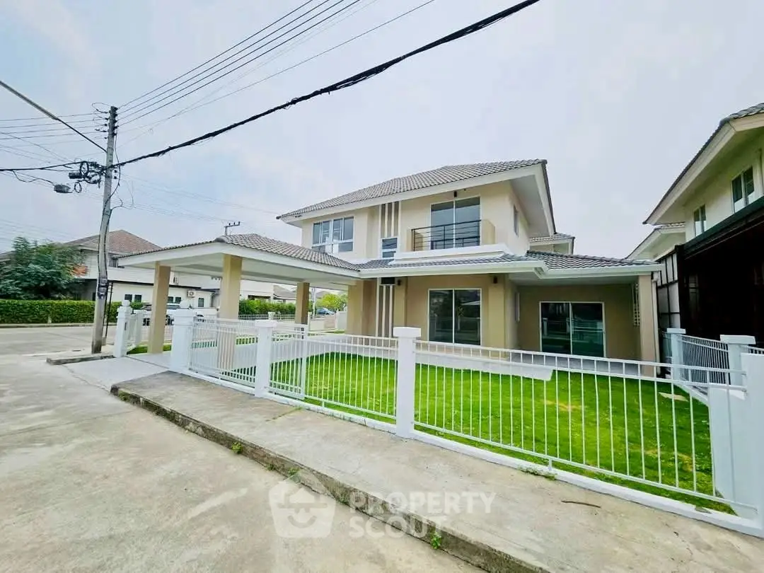 Charming suburban house with modern design and lush green lawn in a peaceful neighborhood.