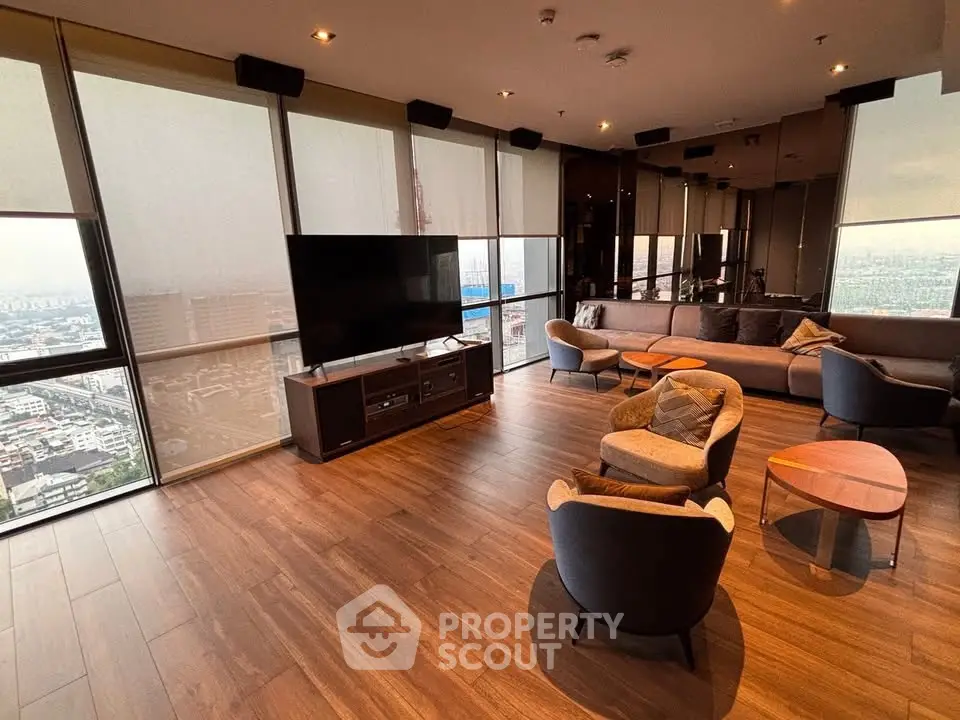 Luxurious high-rise living room with panoramic city views and modern furnishings.
