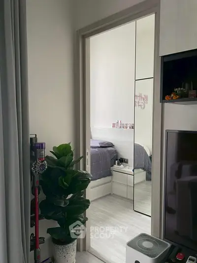 Modern bedroom with mirrored closet and stylish decor