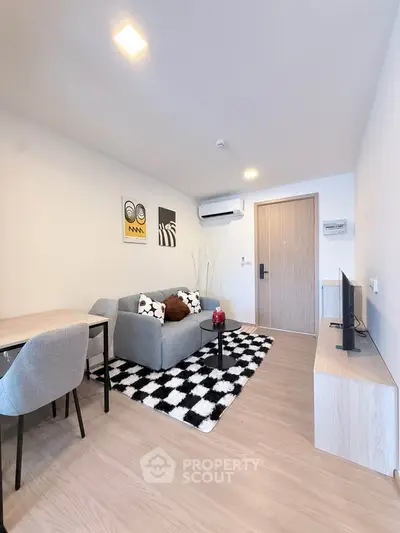 Modern living room with stylish decor and cozy seating area, perfect for relaxation and entertainment.