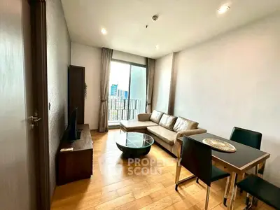 Modern living room with wooden flooring, cozy sofa, and dining area in a stylish apartment.