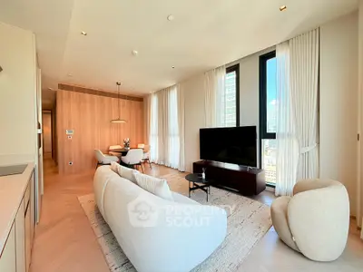Luxurious modern living room with elegant furniture and large windows offering city views.
