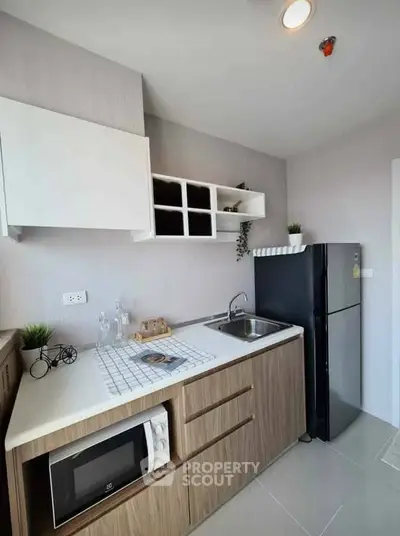 Modern kitchen with sleek cabinetry and stainless steel appliances