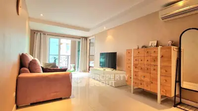 Spacious living room with modern decor and balcony access in a stylish apartment.