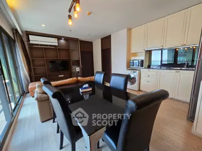 Spacious modern living room with dining area and open kitchen in luxury apartment