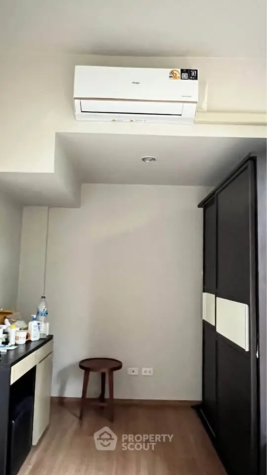 Modern minimalist room with air conditioning and sleek storage solutions