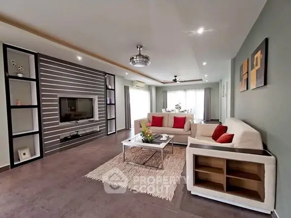 Spacious modern living room with stylish decor and natural light