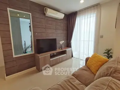 Modern living room with sleek TV unit and cozy sofa, featuring elegant wood paneling and large window for natural light.