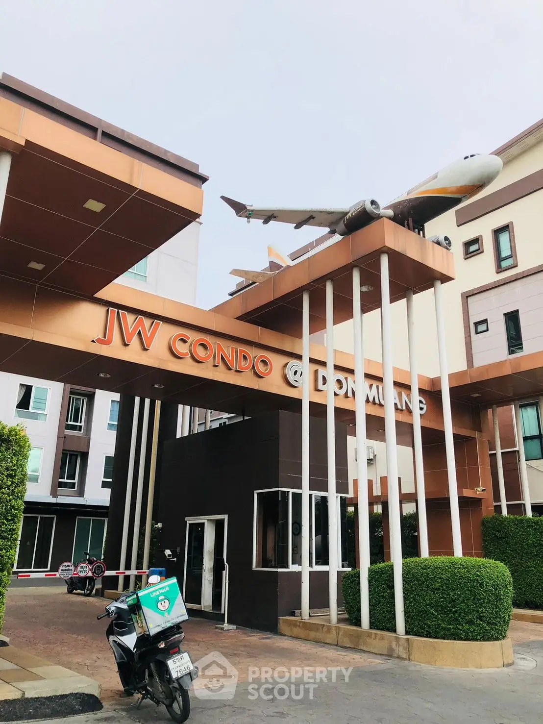 Modern condo entrance with airplane decor at JW Condo Don Muang