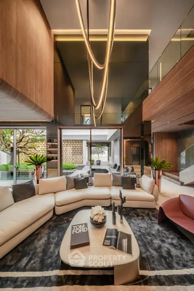Luxurious modern living room with high ceilings and elegant lighting