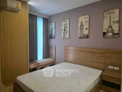 Cozy bedroom with wooden furniture and travel-themed wall art