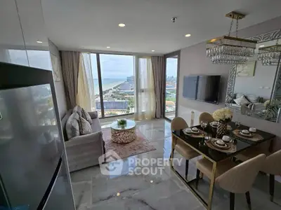 Luxurious living room with stunning ocean view and elegant dining area