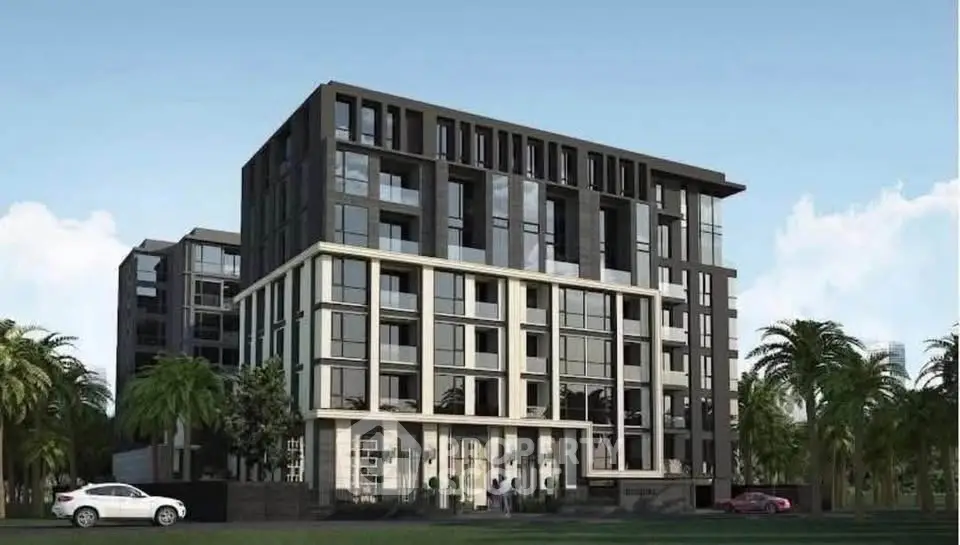 Modern multi-story apartment building with sleek design and palm trees