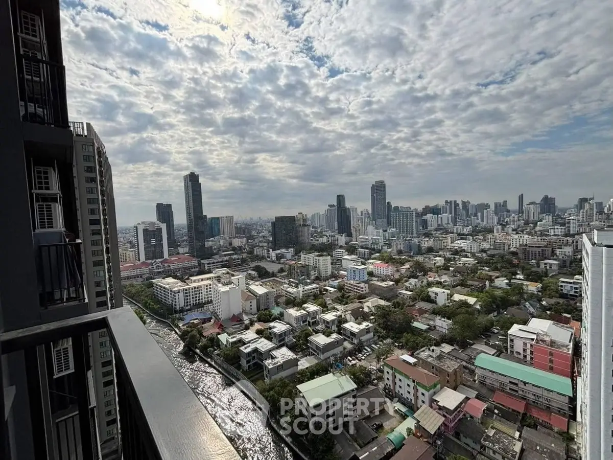 Stunning cityscape view from high-rise balcony with skyline and river