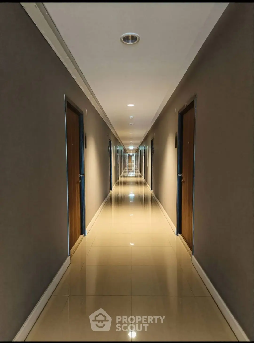 Modern apartment hallway with polished floors and sleek design