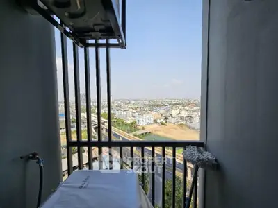 Stunning high-rise balcony with panoramic city view, perfect for urban living enthusiasts.