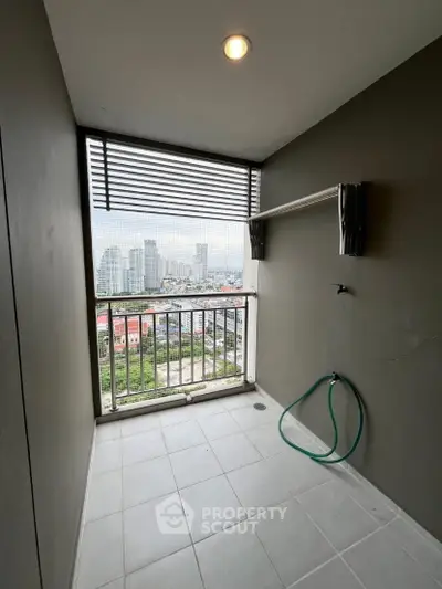 High-rise balcony with stunning cityscape view and modern design.