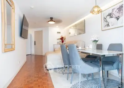 Stylish living room with modern dining area and cozy seating, perfect for entertaining guests.