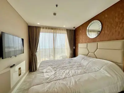 Luxurious bedroom with modern decor and large window offering natural light and city views.