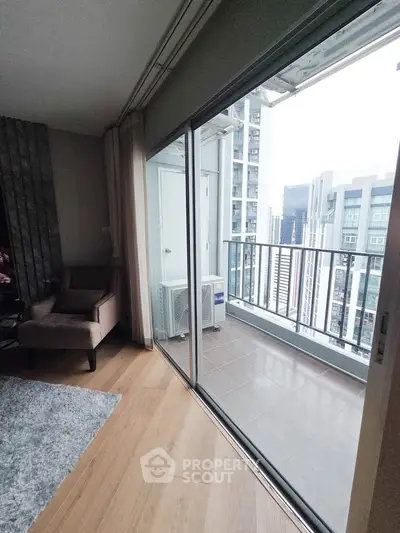 Modern apartment with cozy living room and balcony offering city views