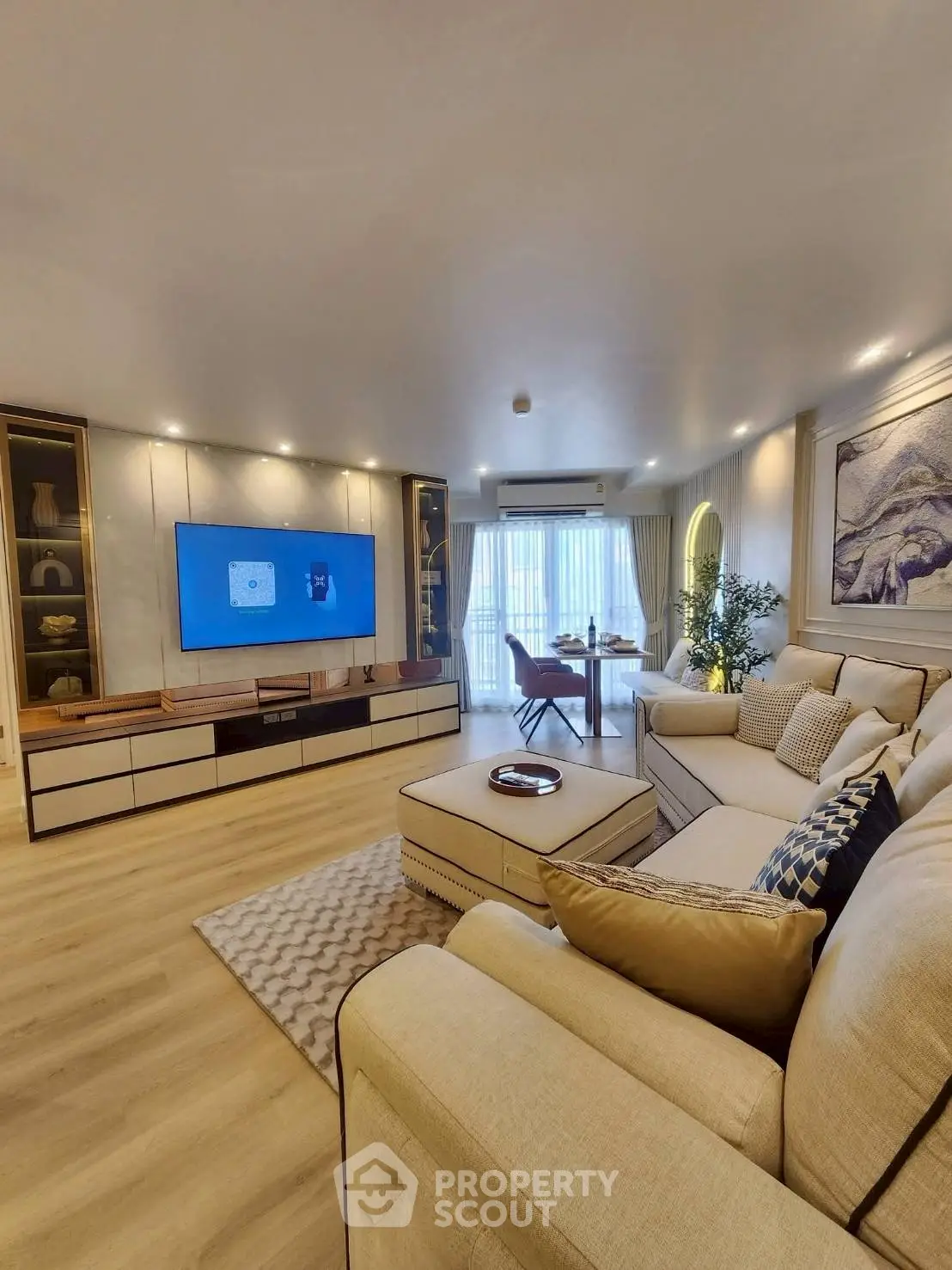 Spacious modern living room with elegant decor and large windows