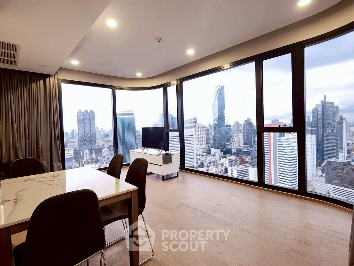 Stunning high-rise apartment with panoramic city views and modern interior design.